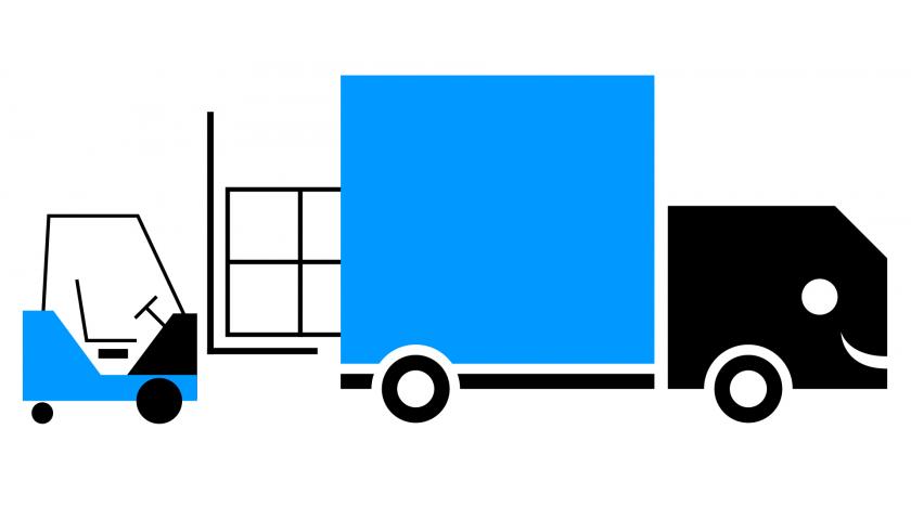 Forklift loading a truck.
